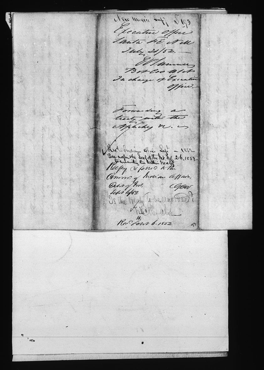 A black-and-white digital scan of the Treaty with the Apache from 1852. There are multiple pieces of paper evident, placed on top of each other. The treaty is in the upper part of the image and reveals, in its center, a series of signatures in different kinds of script. 